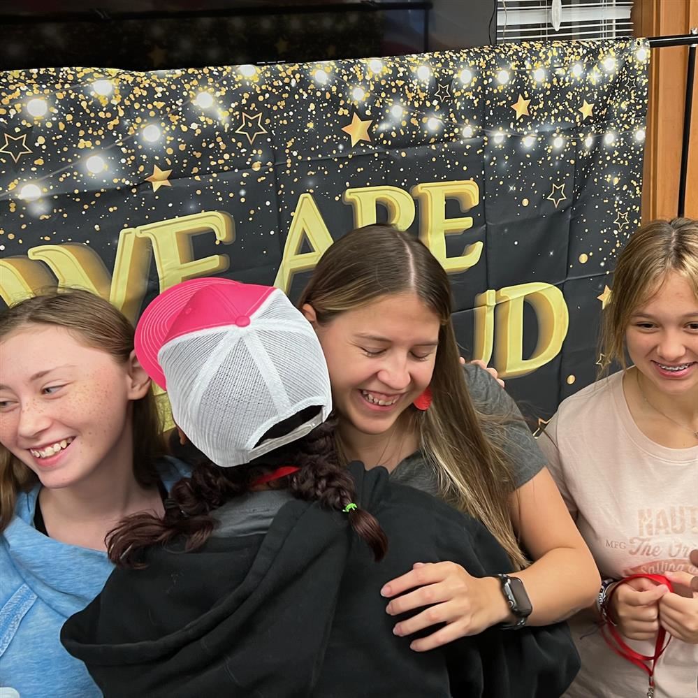 RSS Beginning Teacher of the Year Amber White is congratulated by her students.